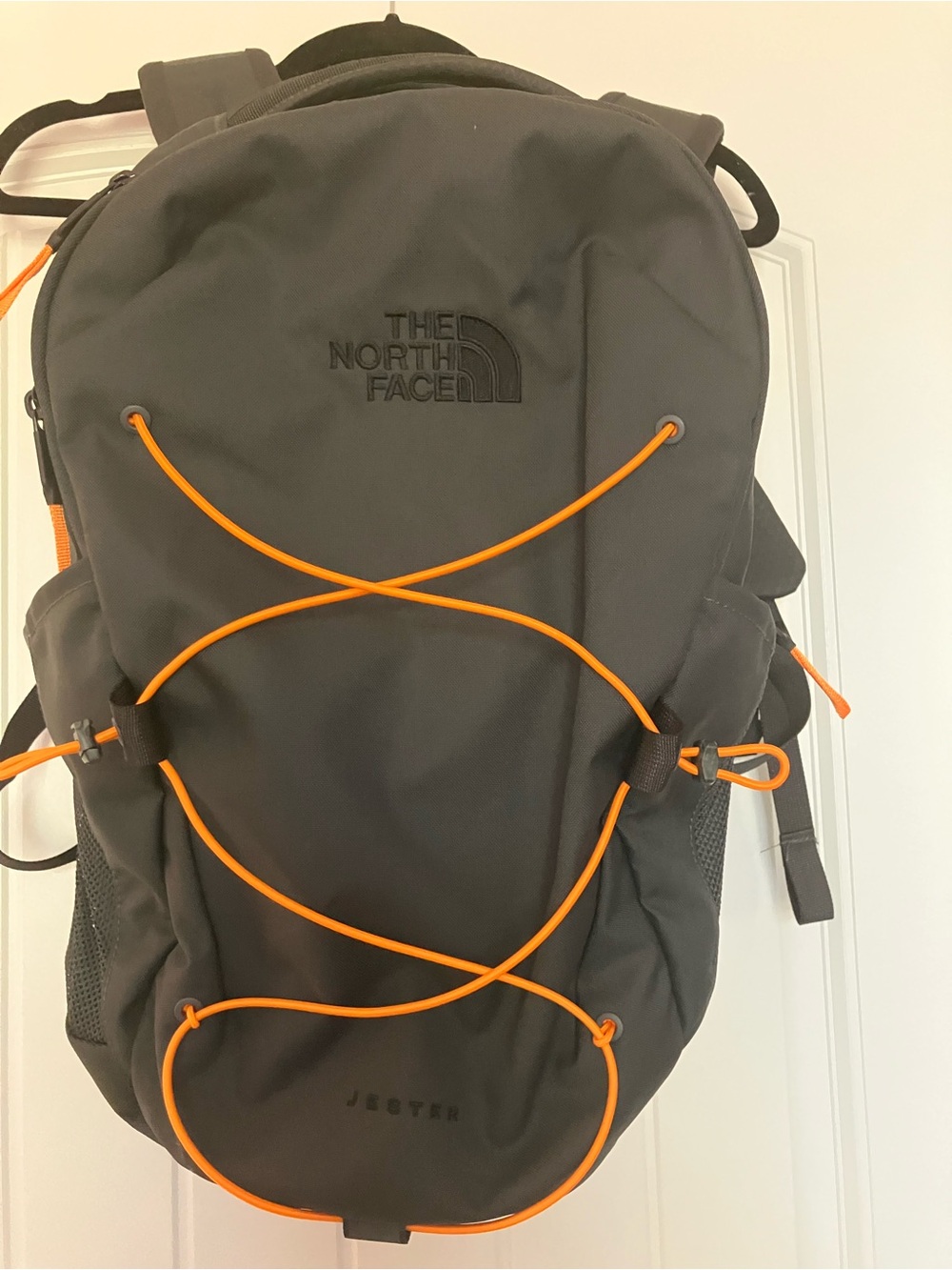 The North Face Black Backpack with Orange Bungee Cords